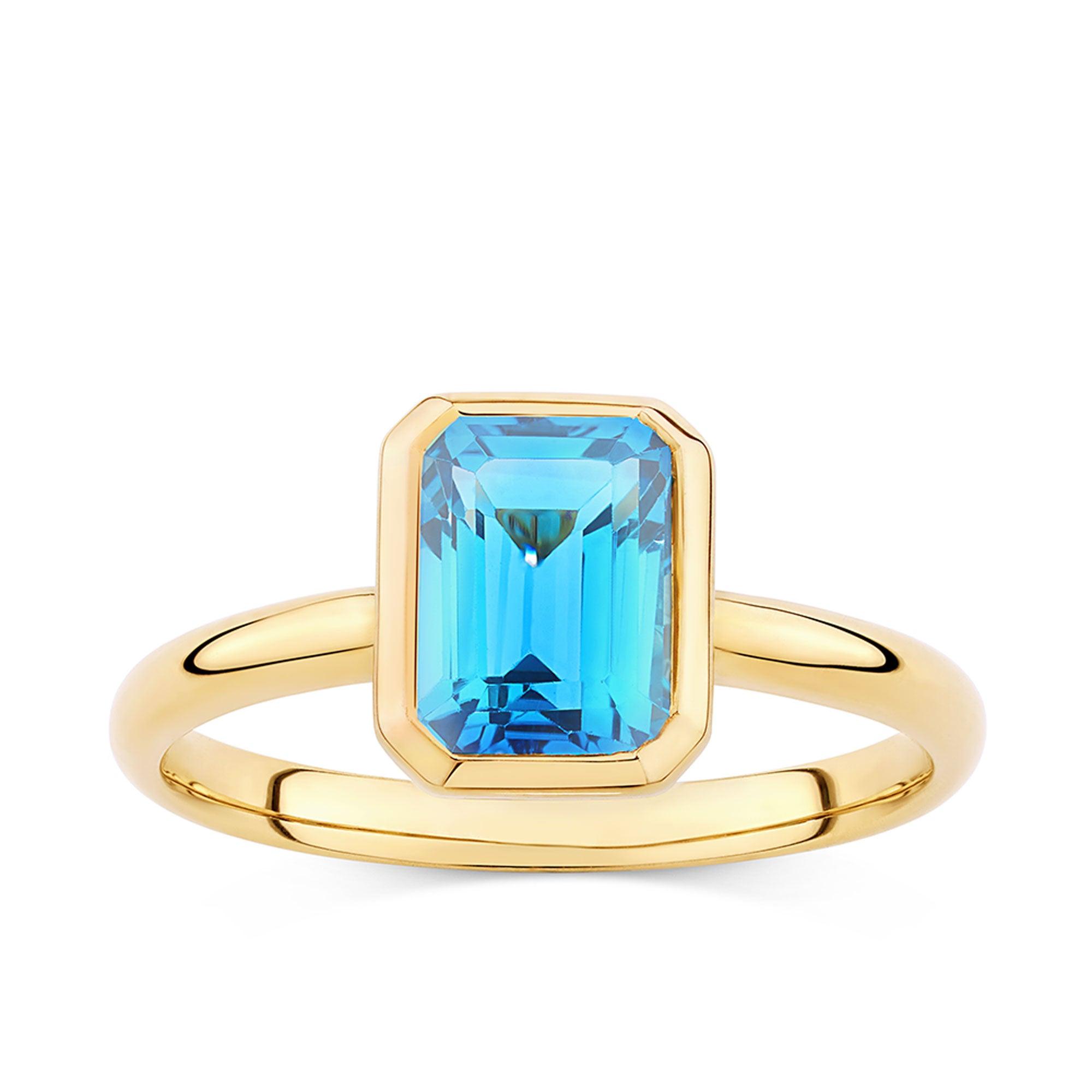 Blue Topaz Emerald Cut Ring in 9ct Yellow Gold